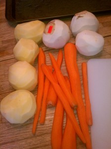 Rutabagas, turnips, and carrots peeled and ready to be cut up.